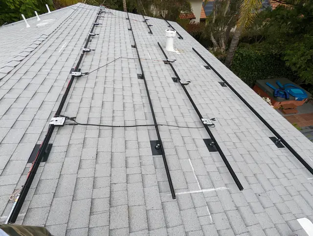 Solar panel mounting detail on a composition shingle roof in Los Angeles, CA