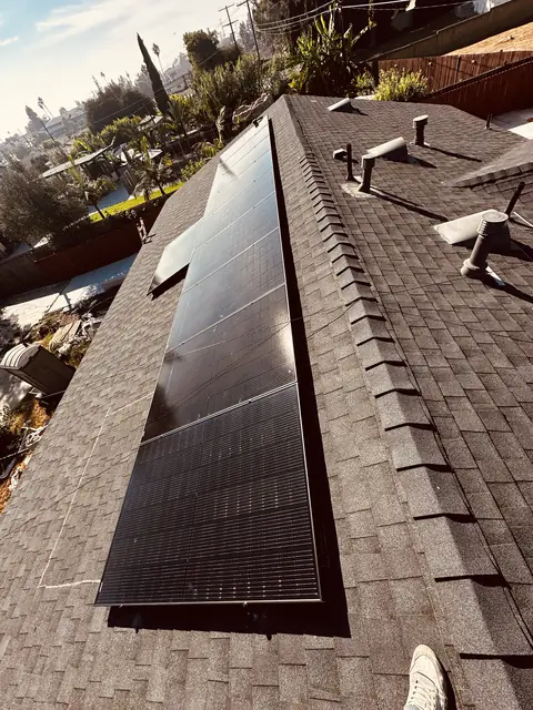 Solar panel mounting detail on a composition shingle roof in Los Angeles, CA