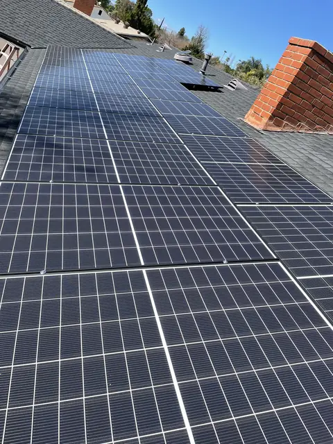 Solar panel mounting detail on a composition shingle roof in Los Angeles, CA