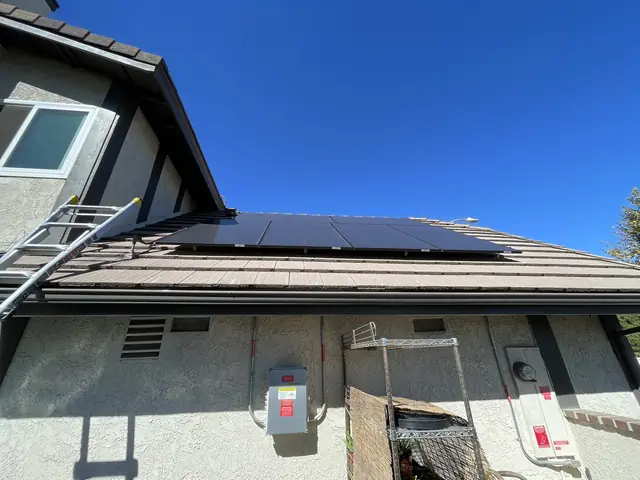 Solar panel mounting detail on a composition shingle roof in Los Angeles, CA