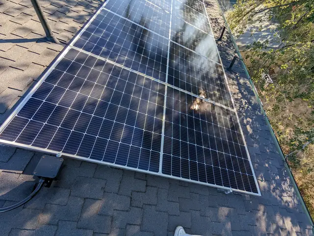 Solar panel mounting detail on a composition shingle roof in Los Angeles, CA