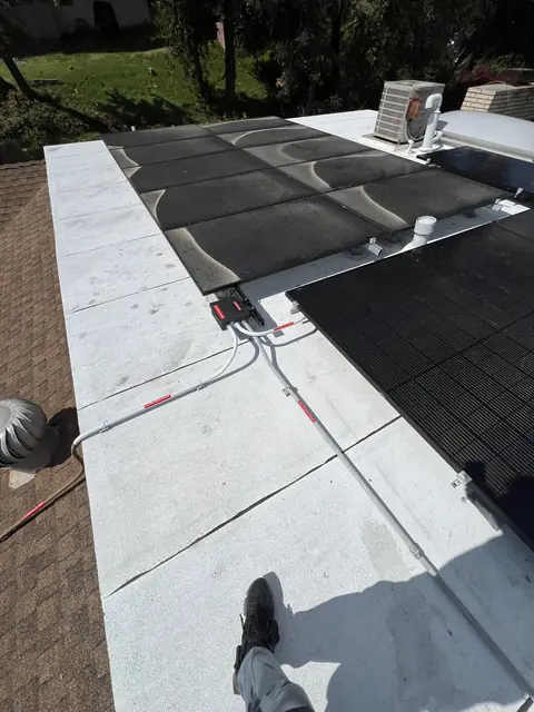 Solar panel mounting detail on a composition shingle roof in Los Angeles, CA