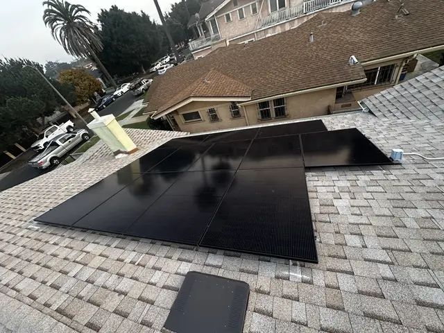 Solar panel mounting detail on a composition shingle roof in Los Angeles, CA