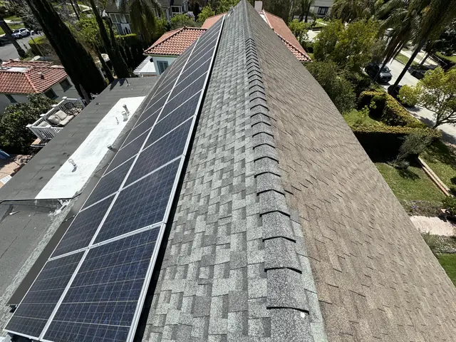 Solar panel mounting detail on a composition shingle roof in Los Angeles, CA