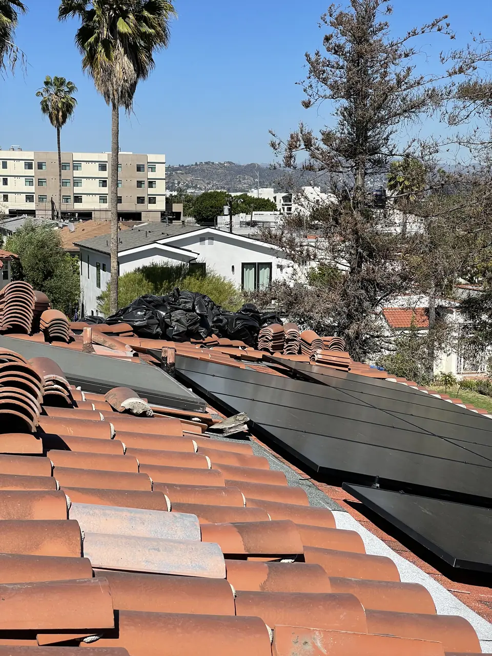 Solar panel mounting detail on a tile roof in Los Angeles, CA