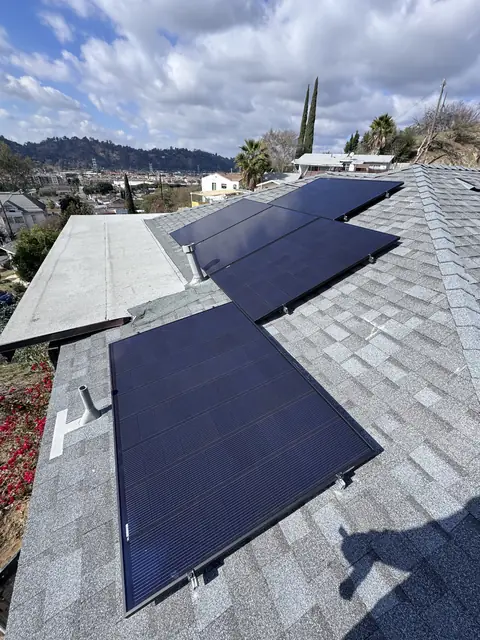 Solar panel mounting detail on a composition shingle roof in Los Angeles, CA