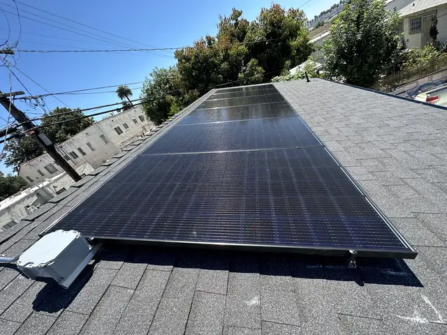 Solar panel mounting detail on a composition shingle roof in Los Angeles, CA
