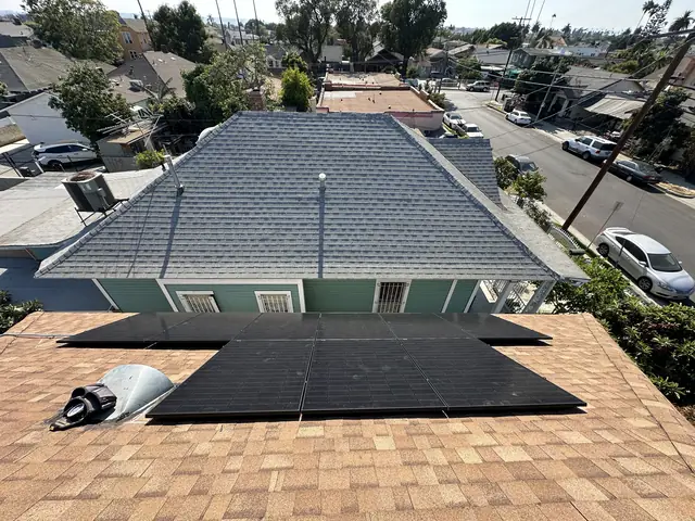 Solar panel mounting detail on a composition shingle roof in Los Angeles, CA
