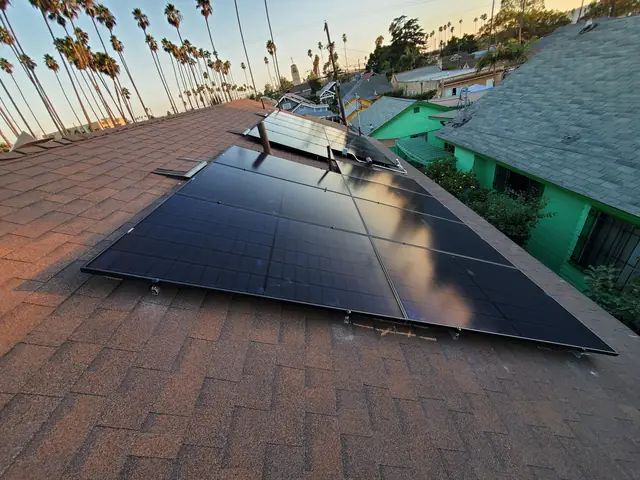 Solar panel mounting detail on a composition shingle roof in Los Angeles, CA