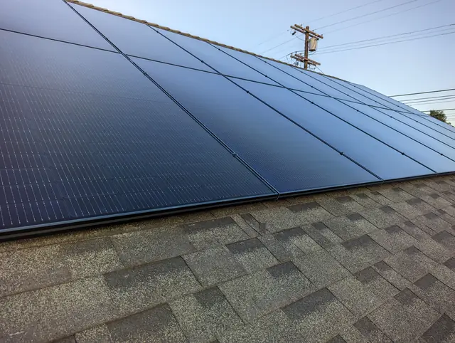 Solar panel mounting detail on a composition shingle roof in Los Angeles, CA
