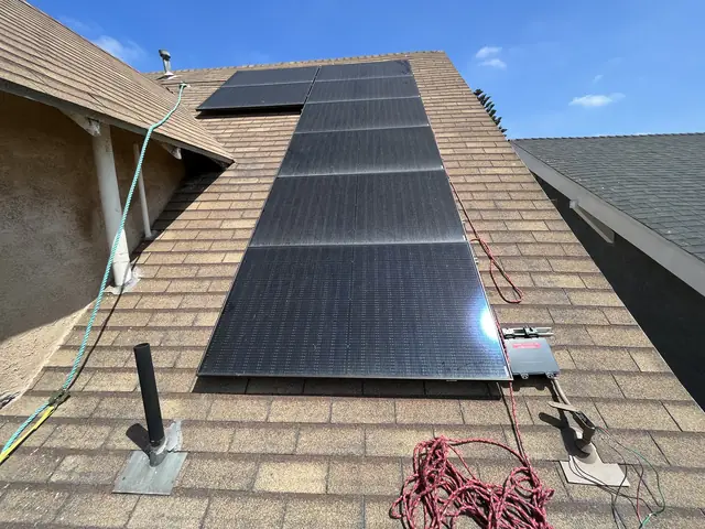 Solar panel mounting detail on a composition shingle roof in Los Angeles, CA