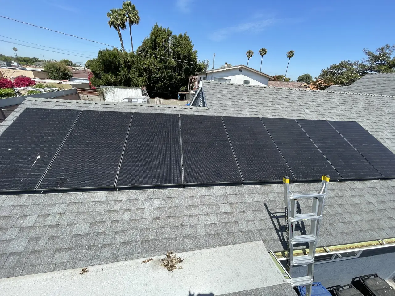 Solar panel mounting detail on a composition shingle roof in Los Angeles, CA