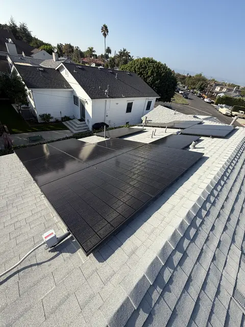 Solar panel mounting detail on a composition shingle roof in Los Angeles, CA