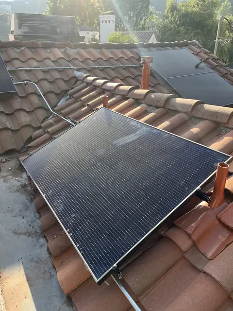 Solar panel mounting detail on a tile roof in Los Angeles, CA