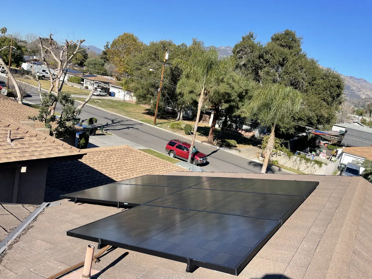 Solar panel mounting detail on a composition shingle roof in Monrovia, CA