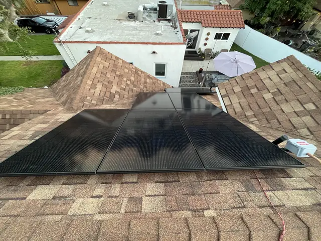 Solar panel mounting detail on a composition shingle roof in Monrovia, CA