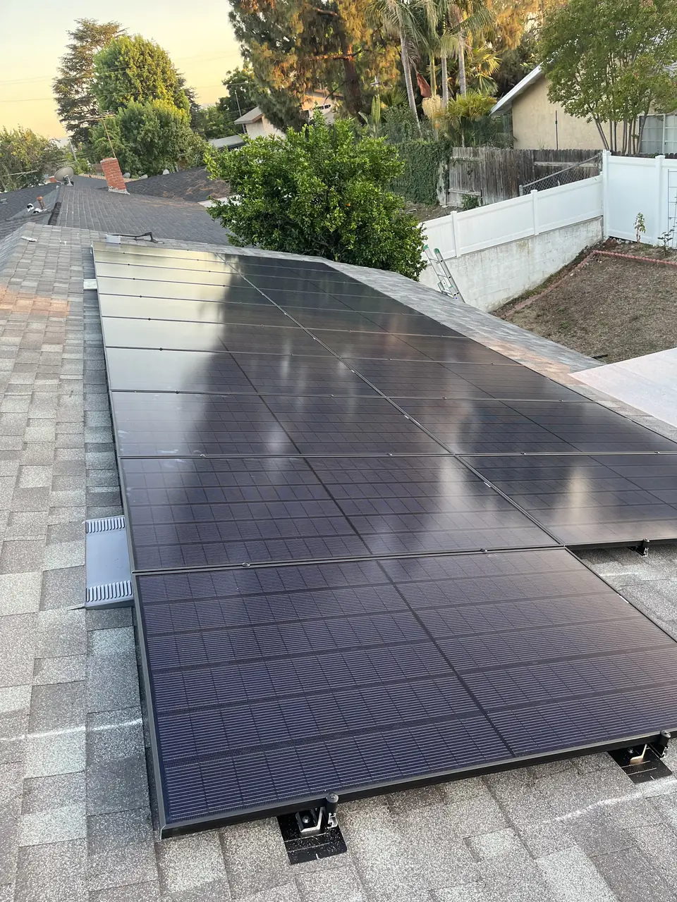 Solar panel mounting detail on a composition shingle roof in Monrovia, CA