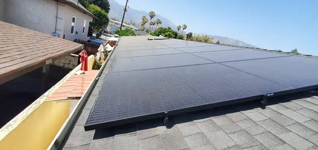 Solar panel mounting detail on a composition shingle roof in Monrovia, CA