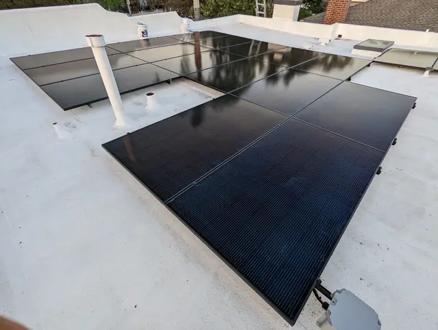 7.2 kW solar panel array on a flat roof in Monrovia, CA