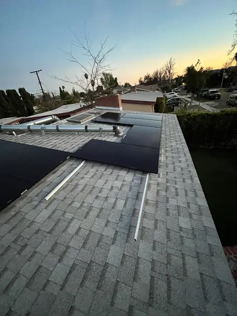 Solar panel mounting detail on a composition shingle roof in North Hollywood, CA