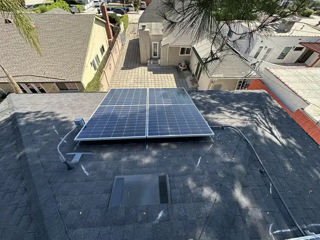 Solar panel mounting detail on a composition shingle roof in North Hollywood, CA