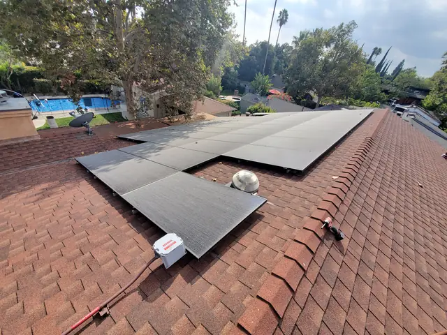 Solar panel mounting detail on a composition shingle roof in North Hollywood, CA