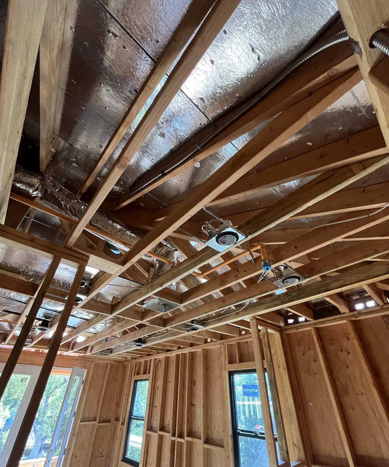 Interior framing and ductwork of a new dwelling under construction, North Hollywood