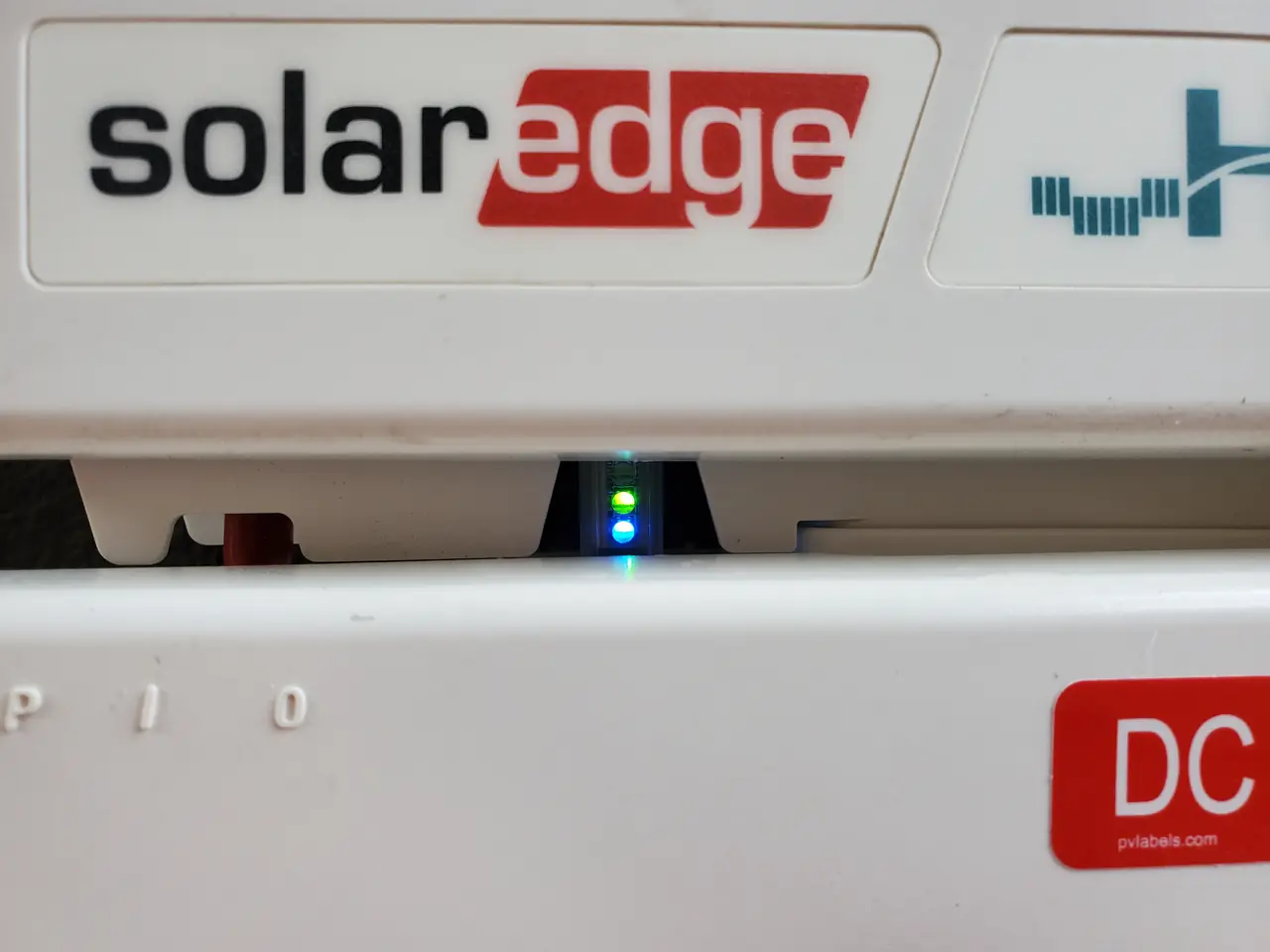The front of a string inverter with its status indicators lit, North Hollywood