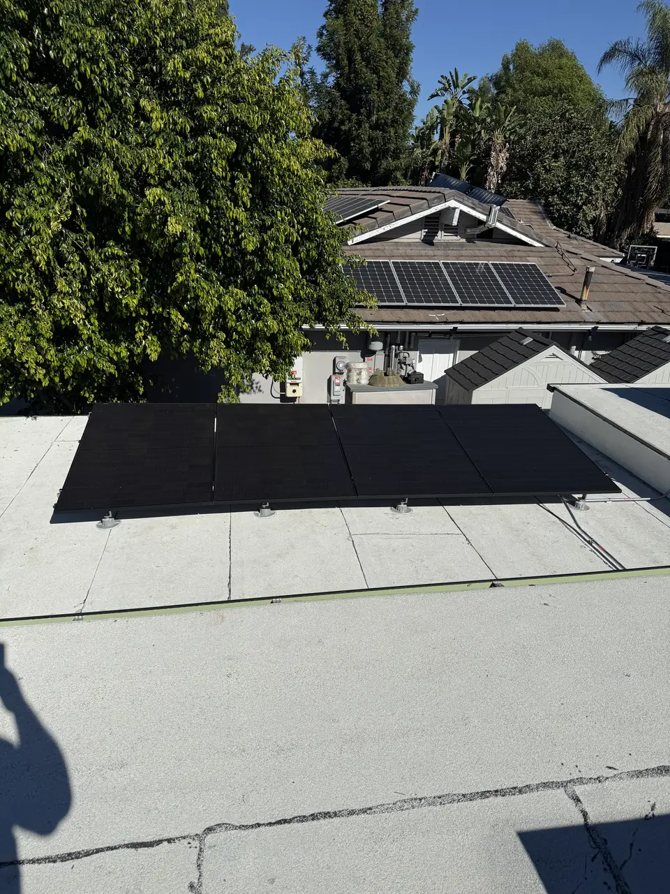 Solar panels ballasted on a flat roof in Northridge