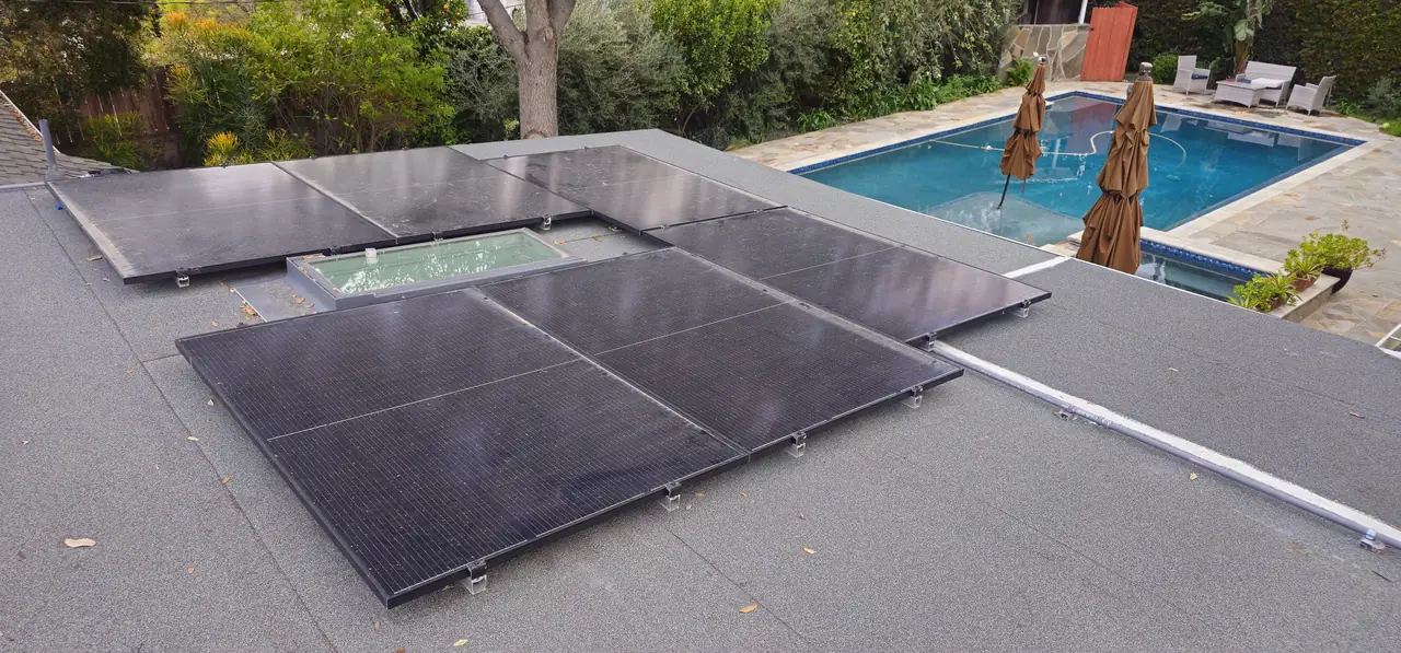 Existing solar array on a flat roof section above a pool, Northridge