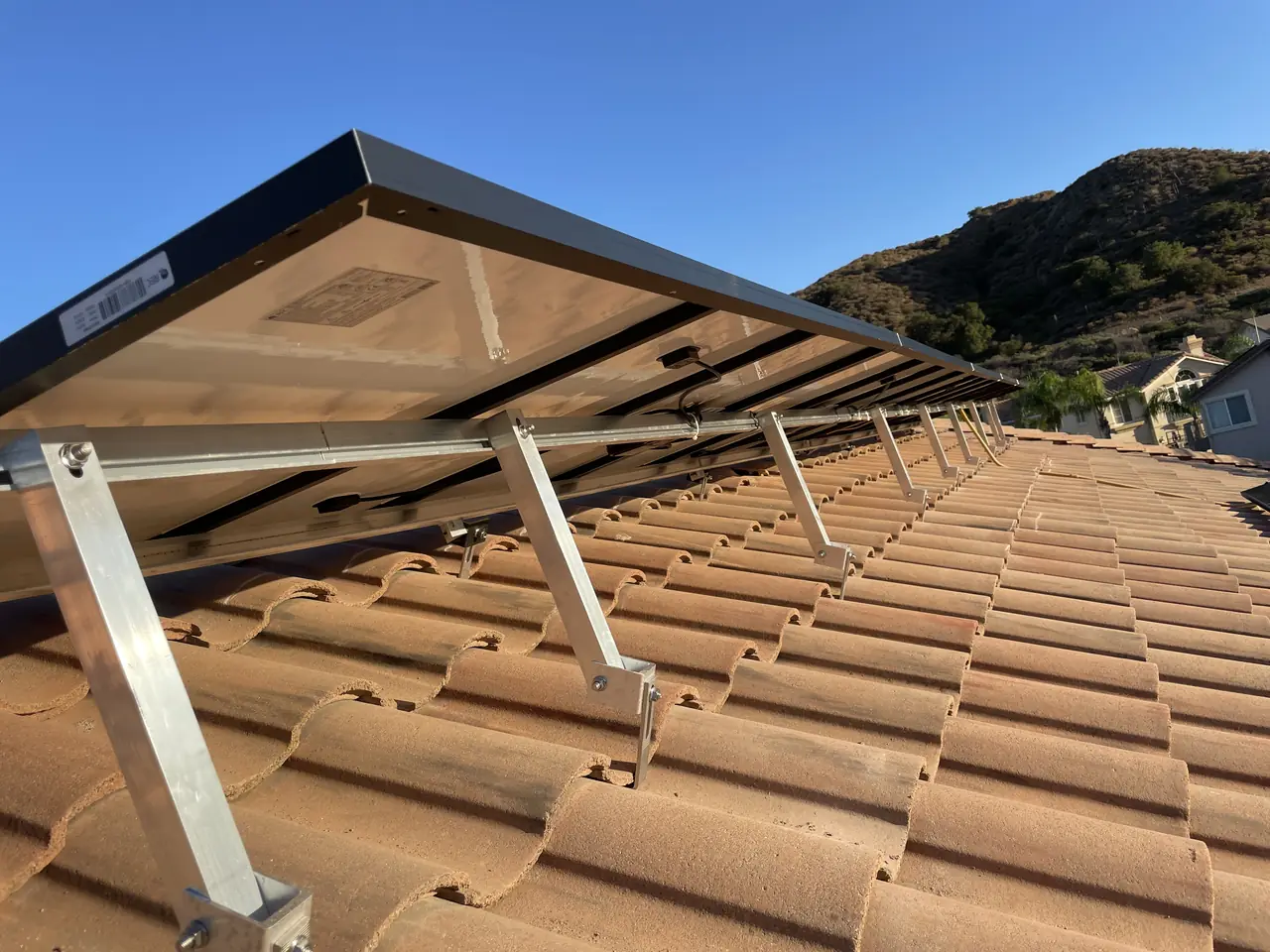 Mounting rails set into a barrel tile roof, Northridge