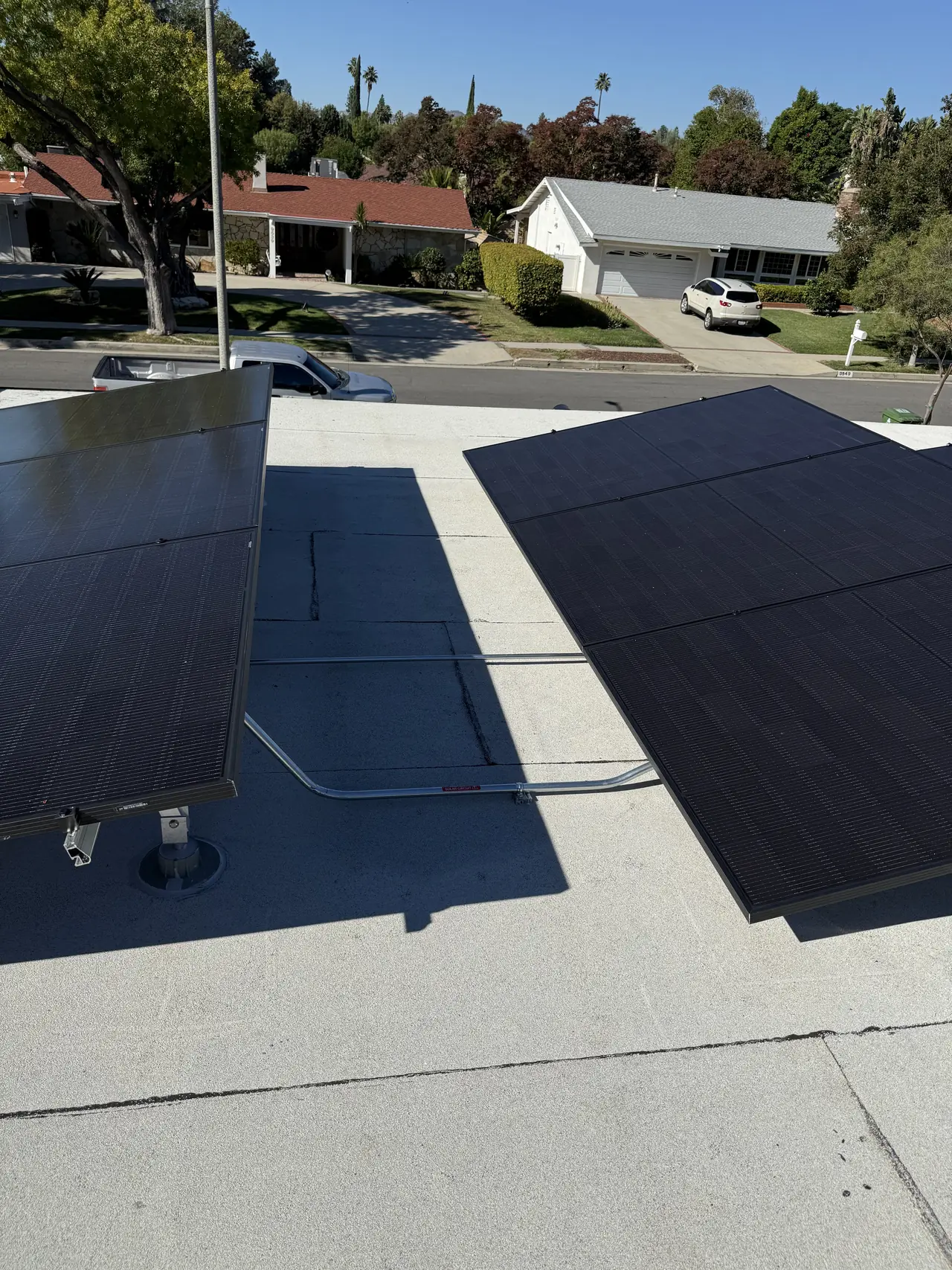 Tilted modules on a flat roof seen across the street, Northridge