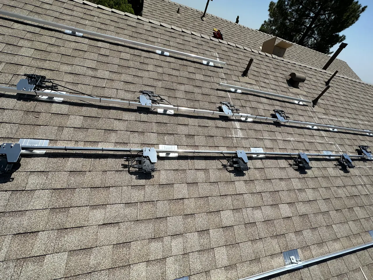 Mounting rails laid across a composition shingle roof, Northridge
