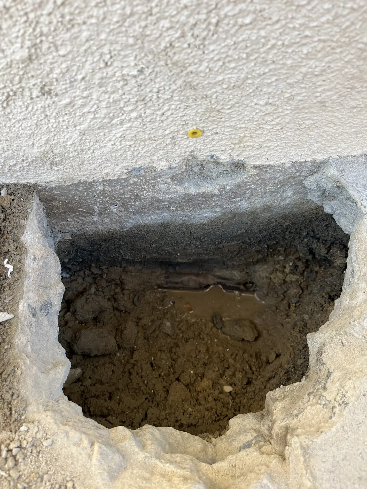 Excavation at the base of a wall for a grounding electrode, Northridge