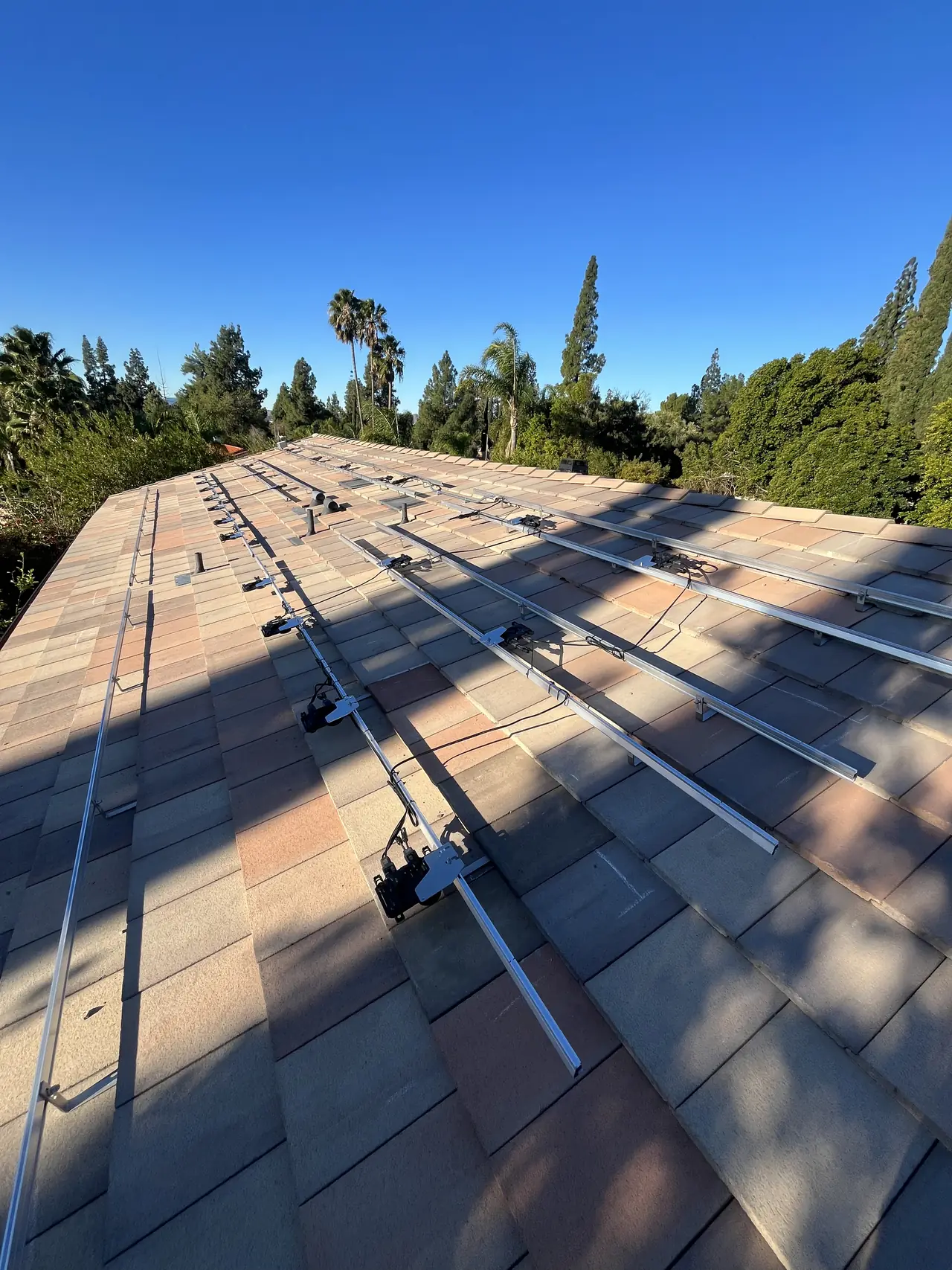 Mounting rails across a blended concrete tile roof, Northridge