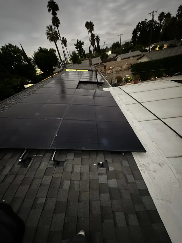 Solar array on a composition shingle roof at dusk, Northridge