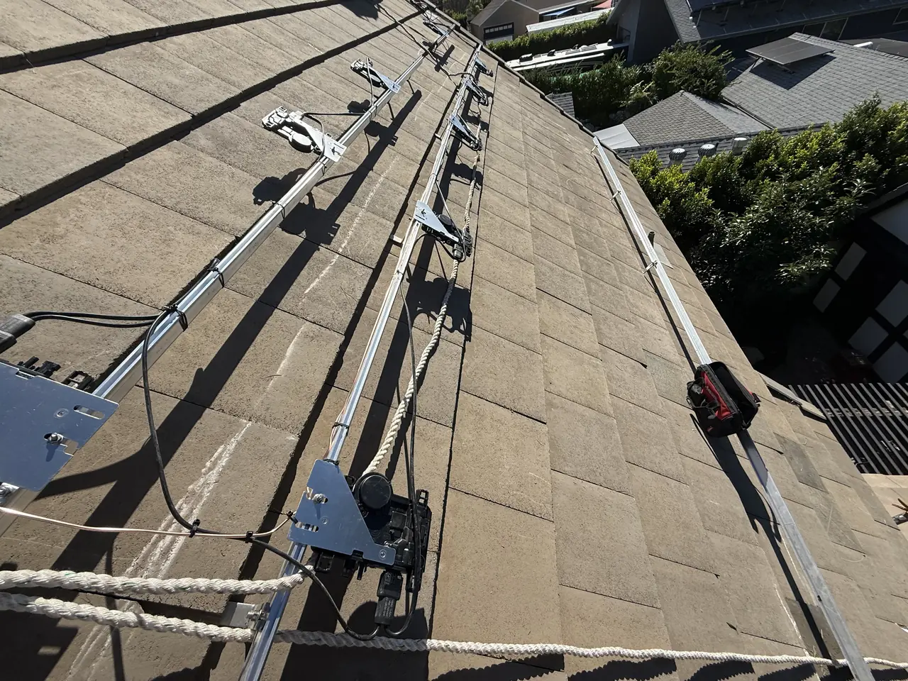 Rails and conduit running across flat concrete tile, Northridge