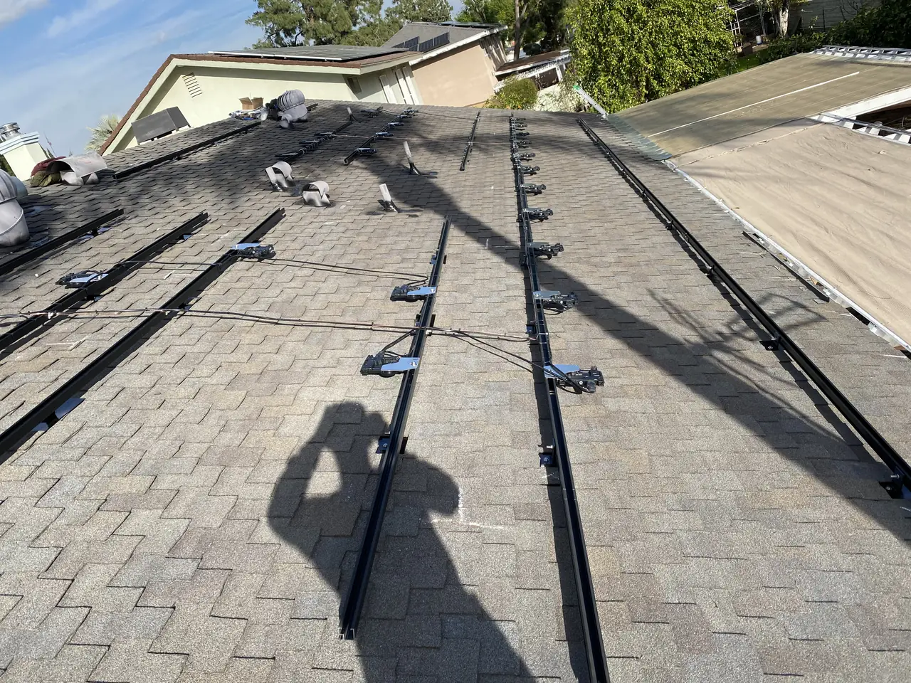 Rails laid out across new composition shingle before the modules, Northridge