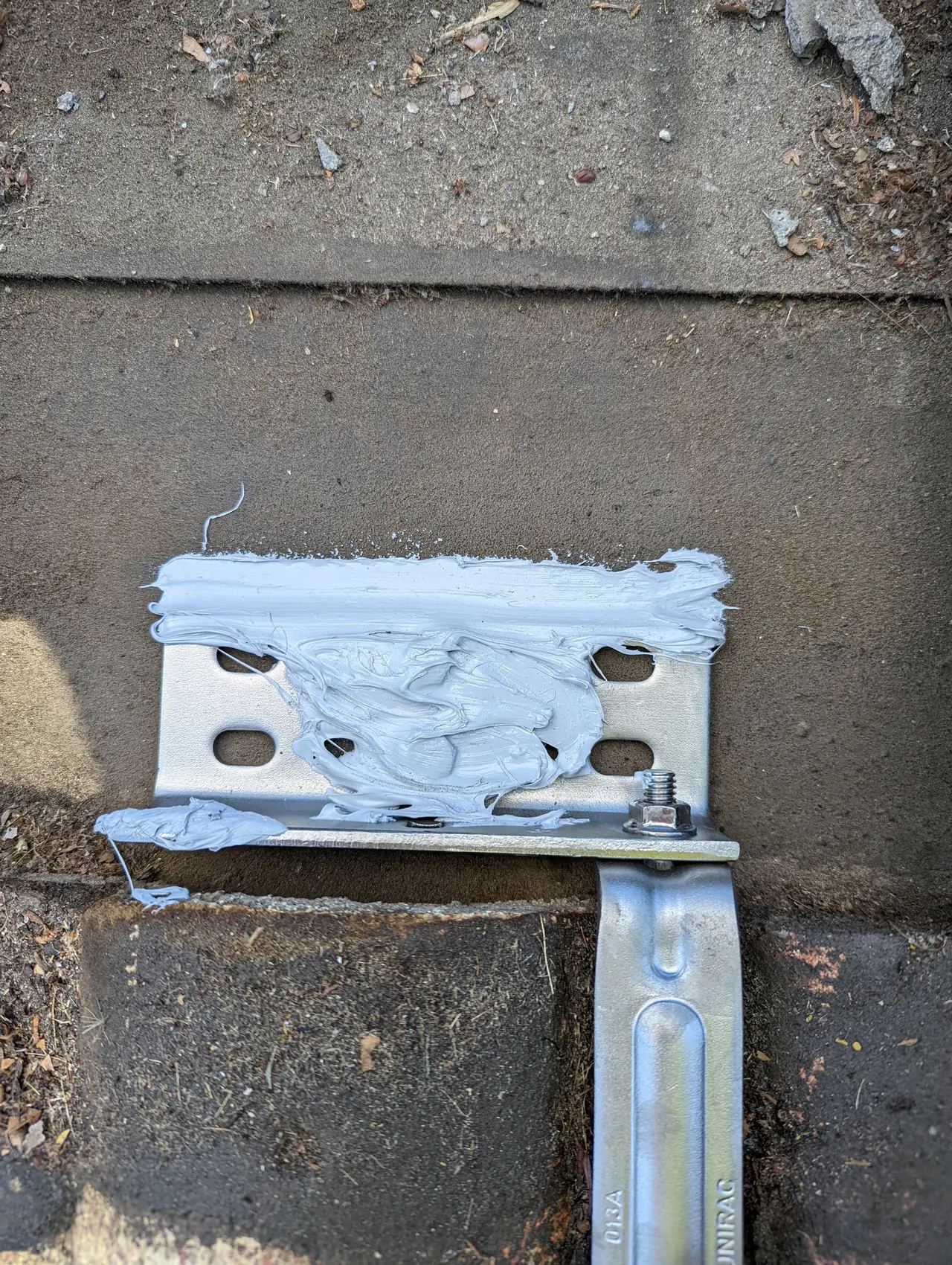Roof attachment bracket flashed and sealed into a tile roof, Northridge