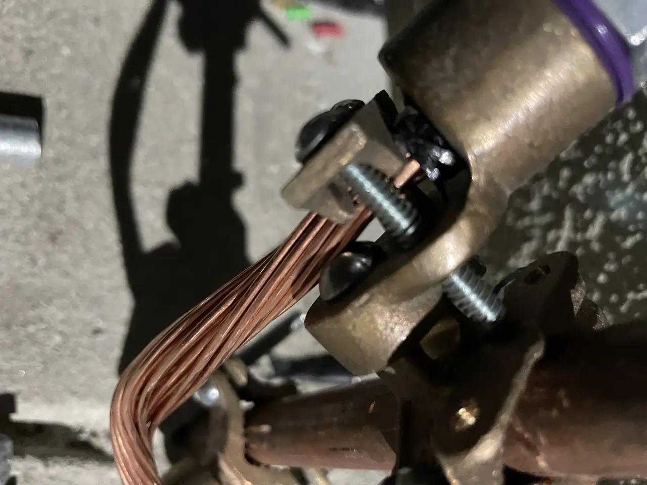 Grounding conductor clamped to a copper pipe at a building wall, Northridge