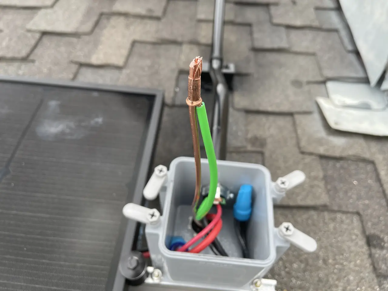 Roof junction box with bonding conductor on a shingle roof, Northridge