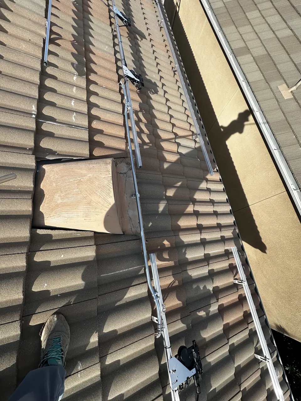 Solar panels across sections of a concrete S-tile roof in Pacoima