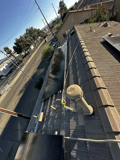 Solar panel mounting detail on a tile roof in Pacoima, CA