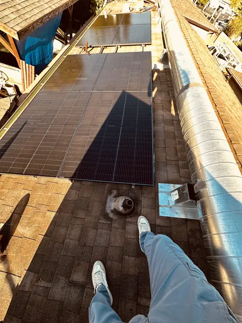 Solar panel mounting detail on a composition shingle roof in Pacoima, CA