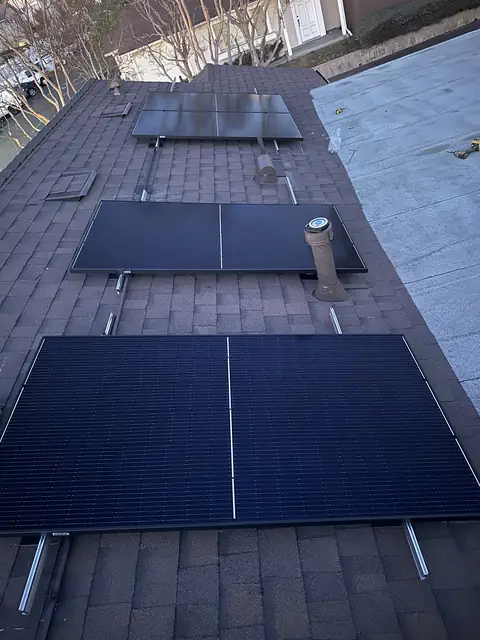 Solar panel mounting detail on a composition shingle roof in Pacoima, CA