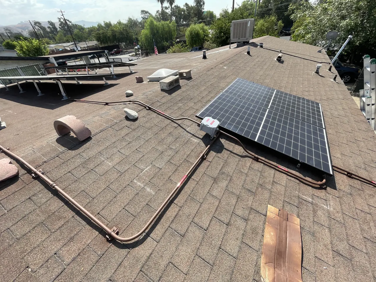 9.3 kW tilt-mounted solar array on a flat roof in Pacoima