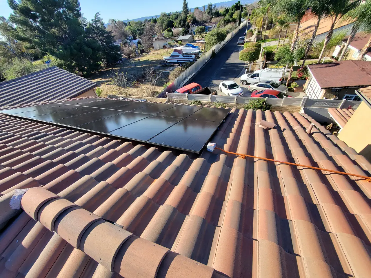 Solar panel mounting detail on a tile roof in Pacoima, CA