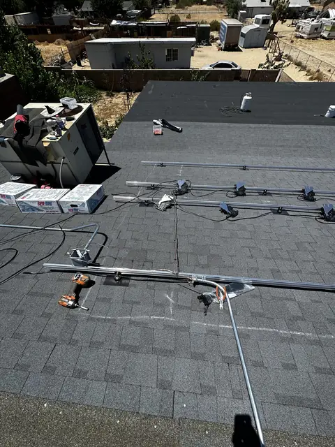 Solar panel mounting detail on a composition shingle roof in Palmdale, CA