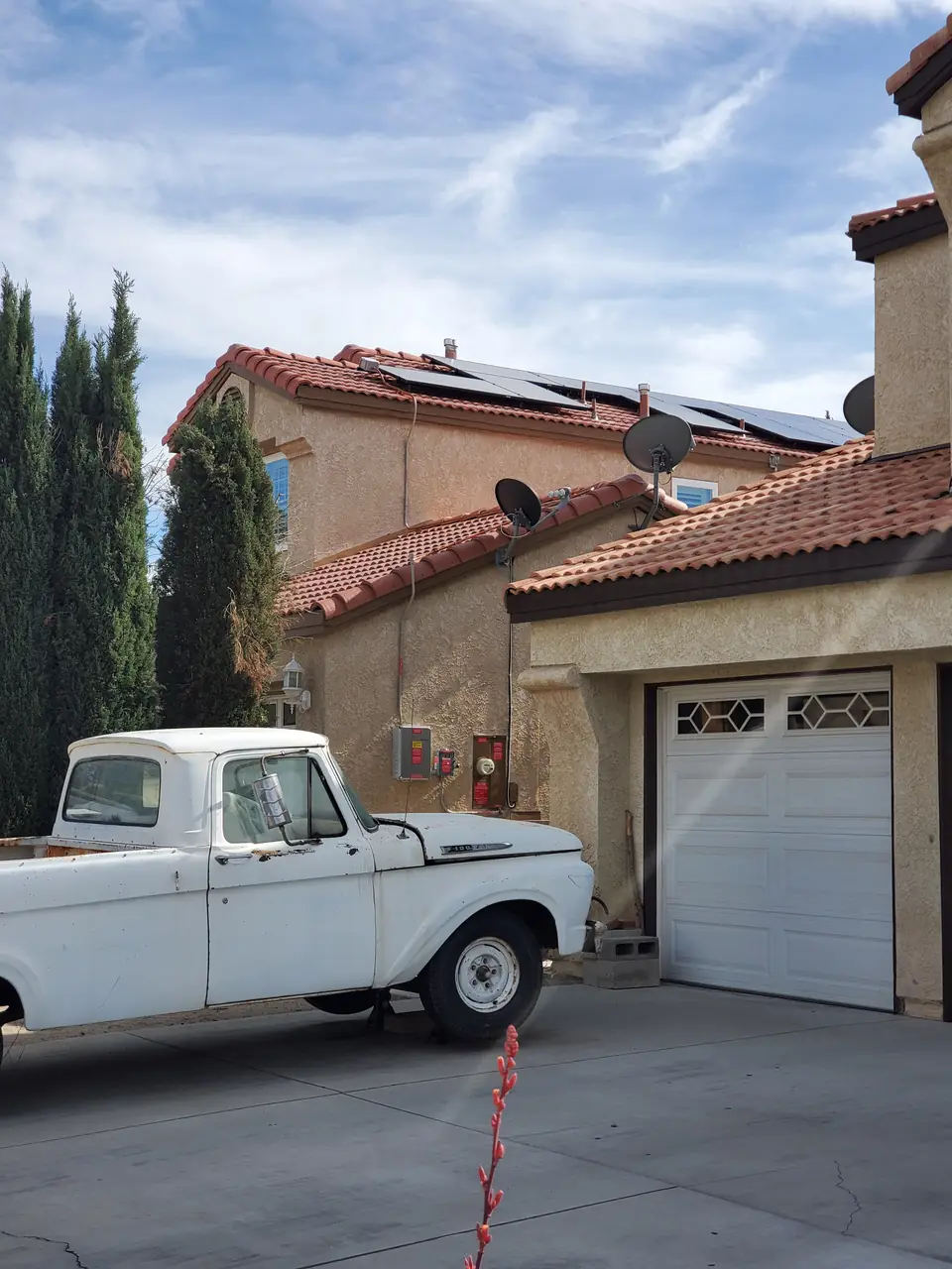 Black-on-black solar panels flush mounted on concrete tile in Palmdale