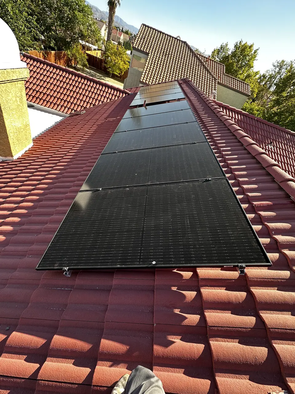 Solar panel mounting detail on a tile roof in Palmdale, CA